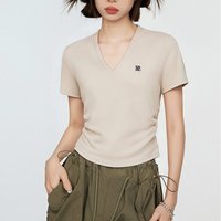 T-shirt pour femme style vintage américain à col en V et manches courtes : couleur unie, coupe courte et design froncé