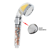 Pommeau de Douche Ionique Filtrant en ABS avec Interrupteur Pause à Touche Unique et Pierres Minérales Rouges pour une Eau Parfumée