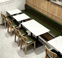 Ensemble de salle à manger moderne et minimaliste en cuir PU avec plateau en pierre et structure en métal pour restaurants et cafés