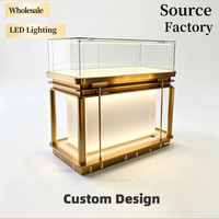 Vitrine de présentation moderne et minimaliste en verre, comptoir de luxe en acier inoxydable avec éclairage LED, pour bijoux, montres et diamants, idéale pour centre commercial ou kiosque.