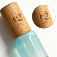 Bouteille d'emballage en verre aromatique bleu dégradé avec bouchon en bois de hêtre