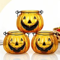 Pot à bougie en verre en forme de citrouille avec poignée en métal pour la décoration d'ambiance du festival d'Halloween