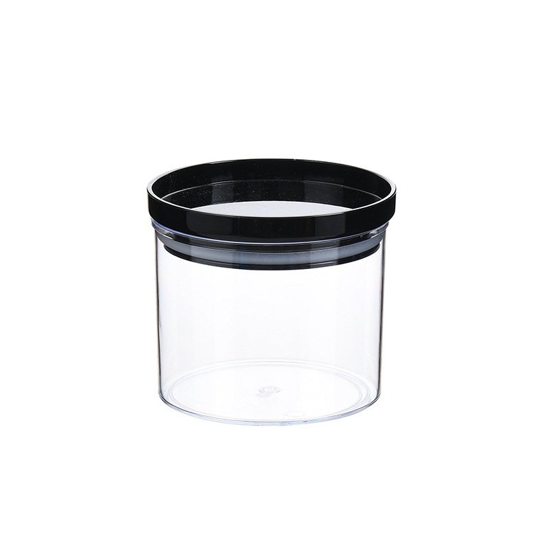 Cuerpo de caja transparente con tapa negra.