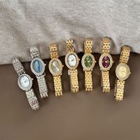 Montre à quartz vintage IEKE, best-seller transfrontalier, montre de luxe tendance ovale sertie de diamants pour femmes avec bracelet en acier fin