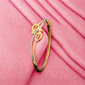 กำไลข้อมือทองสองสี ดีไซน์ทันสมัยสำหรับผู้หญิง ลายฉลุแบบโมเดิร์น น้ำหนักเบา เหมาะสำหรับสวมใส่ในชีวิตประจำวัน ผลิตด้วยงานฝีมือที่ทันสมัย - Product Image 1