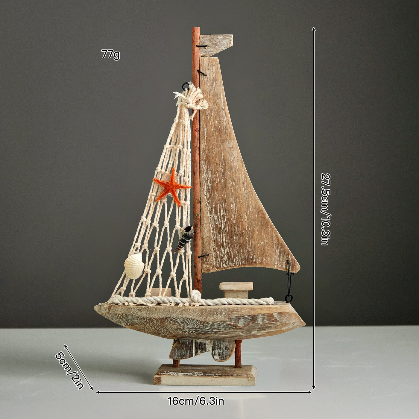 Small wooden sailboat with salad netting