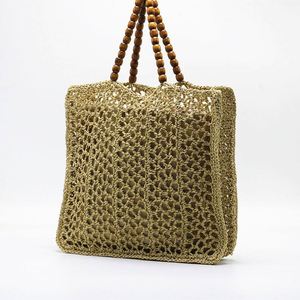 Bolso de playa de malla de ganchillo hueco para mujer, novedad de verano 2025, con asa de cuentas de madera - Product Image 2