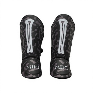 Protège-tibias MMA professionnels Miki 100% coton, cadre en acier à haute teneur en carbone, imprimé numérique camouflage noir, fermeture à double anneau boutonné - Product Image 1