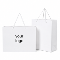 Sac en papier blanc pour boutique de vêtements, emballage de mode, impression de logo personnalisée