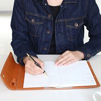 Protège-cahier A5 en cuir PU de haute qualité avec porte-stylo et porte-cartes, personnalisable avec logo