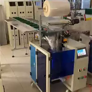 By hand feeding irregular hardware material big size bag tools test kit manual vertical flow packing machine with conveyor