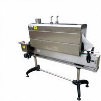 Machine de rétraction de manchons d'étiquettes par tunnel de vapeur