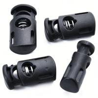 Attache-cordon robuste en plastique noir mat avec rainures latérales et trou unique pour cordons de serrage, sacs à dos et vêtements