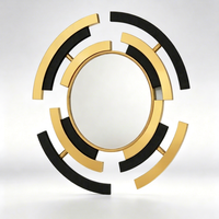 Miroir mural rond abstrait noir et or de luxe, miroir décoratif incurvé et assemblé de style Art déco moderne pour entrée d'hôtel ou de villa