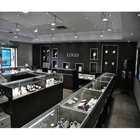 Vitrine d'îlot à bijoux en verre avec structure en acier inoxydable, combinaison modulaire personnalisée pour partenaire Fortune 500, pour kiosque de centre commercial