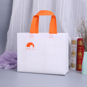 Sac de courses non tissé élégant blanc avec poignée orange, écologique, impression de logo personnalisé, usage professionnel - Product Image 1