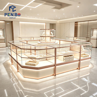 Kiosque de présentation de bijoux de luxe sur mesure en or rose, vitrine à bijoux en verre éclairée par LED, comptoir d'îlot pour bijouterie de centre commercial
