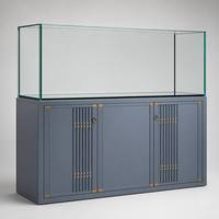 Grand aquarium en verre avec meuble en aluminium, système de débordement et filtre externe.