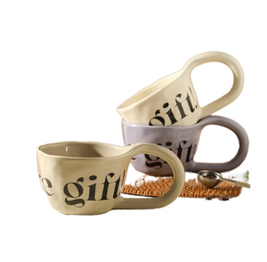 Tasses à boire en céramique élégantes avec inscription 'The Gift', design moderne, compatibles lave-vaisselle et micro-ondes, portables, pour la décoration intérieure - Product Image 1