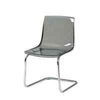 Chaise de loisirs de luxe en plastique ambre transparent avec base chromée