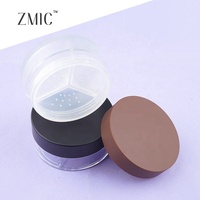 Boîtier à poudre rond avec 3 compartiments, fond transparent givré, couvercle brun peint par pulvérisation, vide pour 3 teintes de poudre libre fixatrice