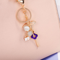Nouveau porte-clés pendentif en alliage de zinc avec pierre œil-de-chat et trèfle à quatre feuilles, style coréen exquis et tendance, breloque de sac ou de voiture