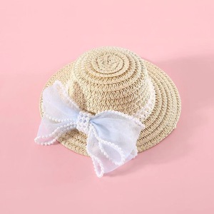 Hermoso sombrero de paja para niños con lazo de perlas, accesorio unisex para exteriores - Product Image 2