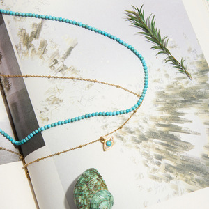 Collier superposé tendance avec pendentif œil turc en turquoise, chaîne dorée et design perlé, idéal pour offrir - Product Image 3