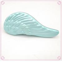 Logo personnalisé en gros ailes d'ange portable démêlant brosse à cheveux flexible antistatique en plastique de massage peigne