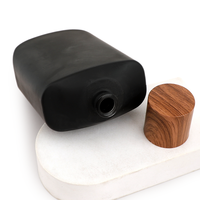 Flacon de parfum rectangulaire arrondi noir mat de 100 ml avec bouchon en bois, vide et rechargeable, vente en gros directe d'usine