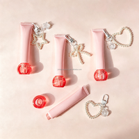 Tube de gloss sphérique avec couvercle à vis, tube cosmétique à air comprimé avec chaîne, tube de crème pour les yeux avec applicateur en silicone souple