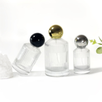 Nouvelle conception de flacon de parfum en verre vide de luxe pour soins de la peau, cylindre rond de 30 ml, 50 ml, 100 ml, flacon d'huile essentielle