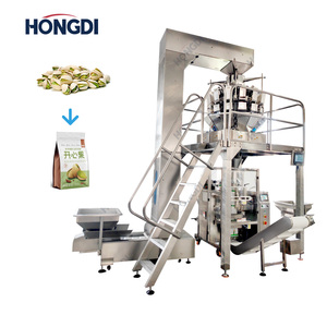 Un peseur combiné à 14 têtes associé à une machine d'emballage de granulés à 8 postes, utilisée pour l'emballage de chips, de noix et de fruits secs. - Product Image 1