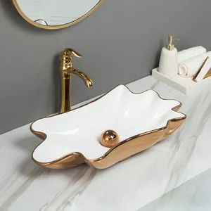 Lavabo de baño de lujo para Hotel, lavabo de porcelana con aspecto de mármol, forma de concha de cerámica, lavabo de mármol artístico, lavabo de encimera