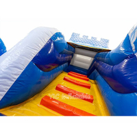 Château Elsa bleu commercial avec toboggan pour fêtes d'enfants, robuste et durable