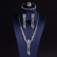 Ensemble de bijoux de mariage et de fête pour femmes, collier, boucles d'oreilles, bracelet, bague, design géométrique de haute qualité en laiton et zircon