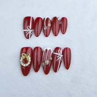 El arte de uñas portátil hecho a mano puro estilo navideño festivo rojo se puede reutilizar