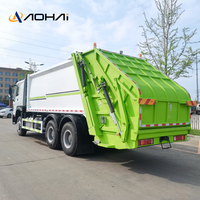 Camion Compacteur de Déchets HOWO 6x4 290HP à Transmission Manuelle, Moteur Diesel, Boîte de Vitesses, Chargeur Arrière à Vendre pour l'Exportation
