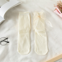 Chaussettes en dentelle mignonnes à la mode avec nœuds japonais Jk et princesse Lolita Style chaussettes mi-tube de couleur unie pour les filles