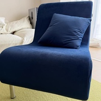 Fauteuil lounge moderne en tissu durable avec structure en acier inoxydable, mobilier pour salons, hôtels, villas. Couleurs personnalisables.