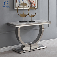 Console de salon moderne de luxe en acier inoxydable et marbre, de forme rectangulaire, pour entrée, couloir ou hall.