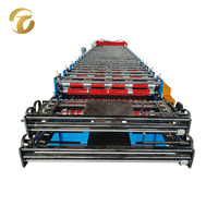 Machine de formage à froid de tôles de toiture ondulées à double couche