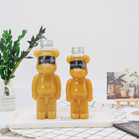 Logo personnalisé jetable emballage transparent PET en plastique long ours en forme de jus lait boba bouteille de thé