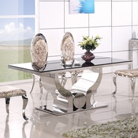 Ensemble de table de salle à manger avec 6 chaises Ensemble de table à manger avec dessus en verre transparent Mobilier de maison de luxe en acier inoxydable Verre trempé moderne