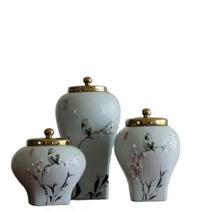 Pot de fleurs et d'oiseaux en céramique avec couvercle en or