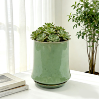 Petit pot de fleurs en céramique vert émeraude au design moderne avec finition émaillée, base cylindrique durable pour une utilisation à la maison ou au jardin