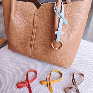 Stylish and minimalist PU leather lanyard keychain, belt <b>bag</b> <b>charm</b>, niche PU leather rope doll accessory. - Product Image 1