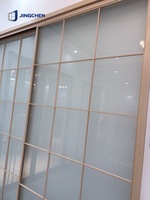 Cloison coulissante moderne en alliage d'aluminium avec verre dépoli double vitrage pour salon, chambre et dressing