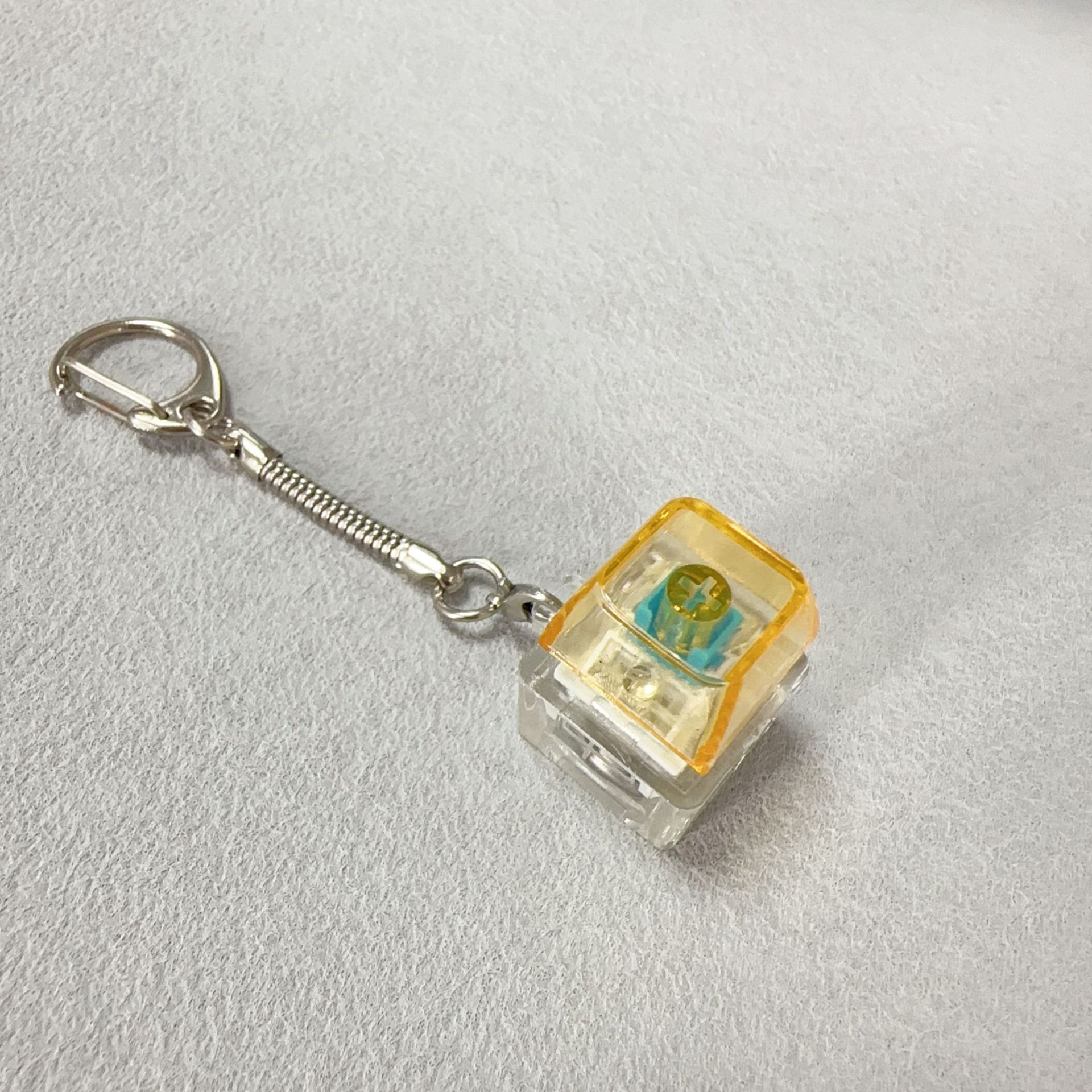 Single-key transparent shell-orange transparent cap+snake bone
