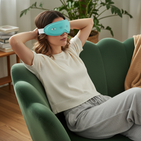 Masque de massage oculaire OEM à points de pression ciblés, chauffant et vibrant, avec minuterie 15 minutes, en silicone, sans fil, musique personnalisable